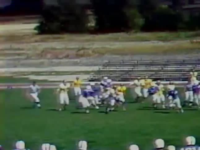 Two teams play football on a field