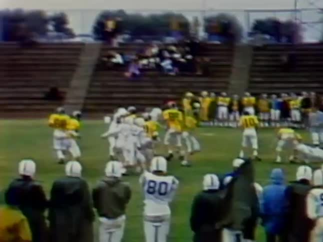 Football players crash against each other on the field
