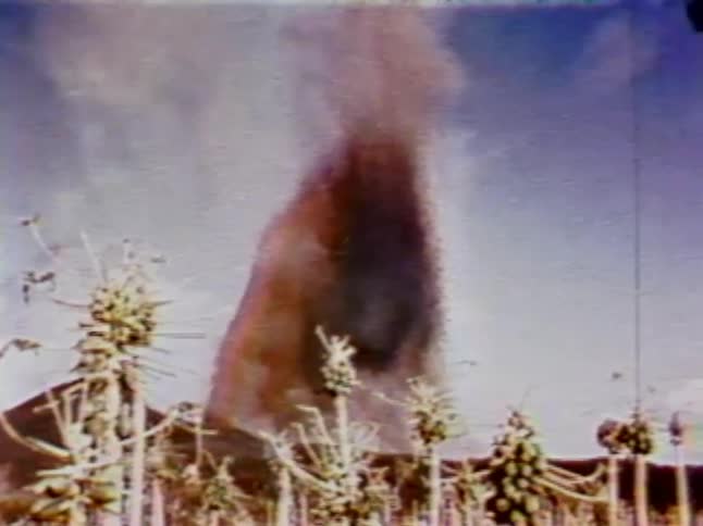 Lava flies into the air in the distance