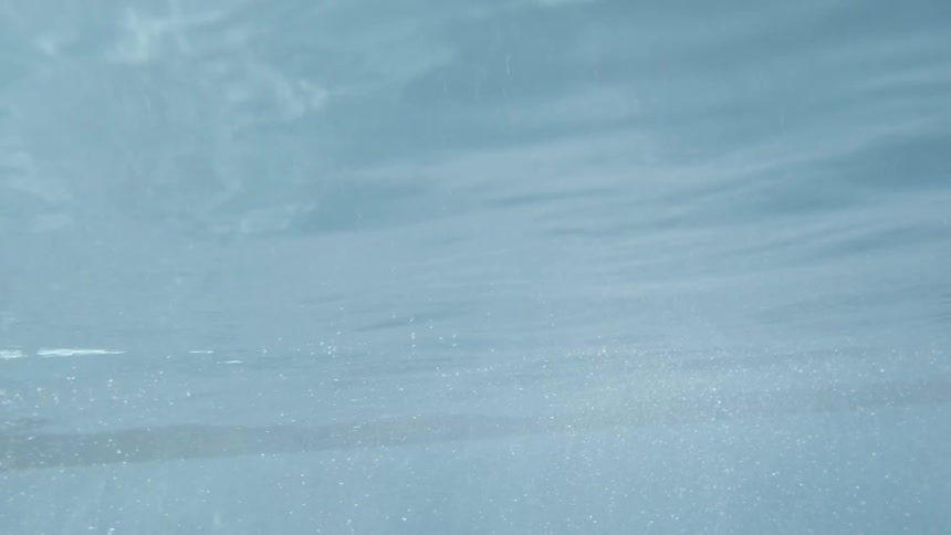 Bubbles float all around the water of this pool