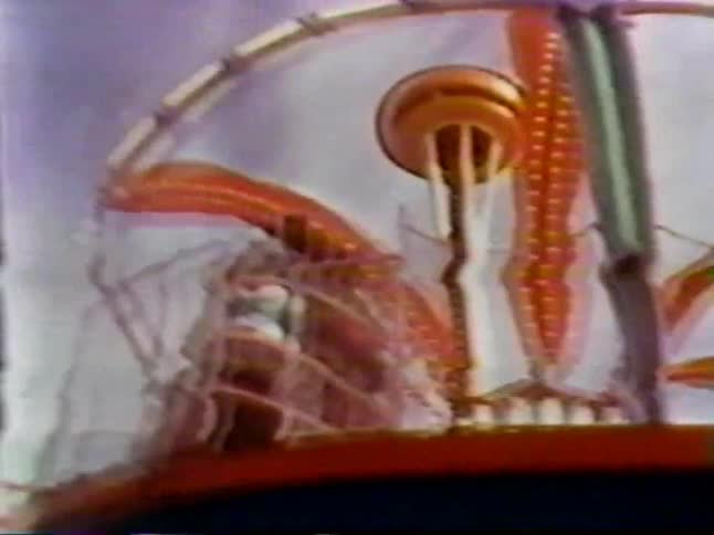 A carnival ride spins with people on it