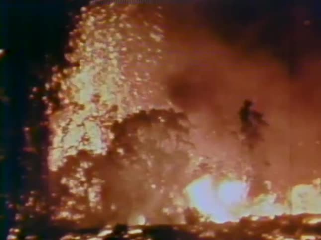 An explosion of fire burning many trees
