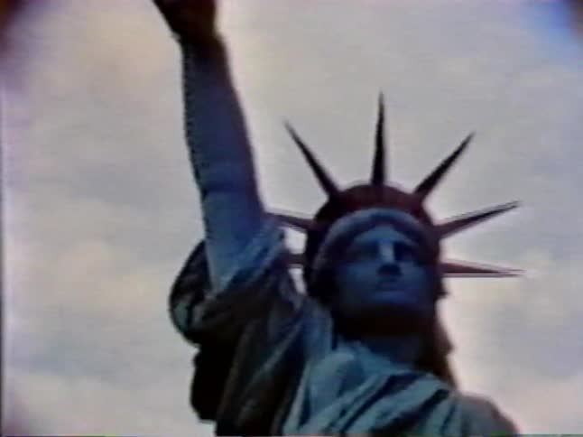 The statue of liberty towers into the sky