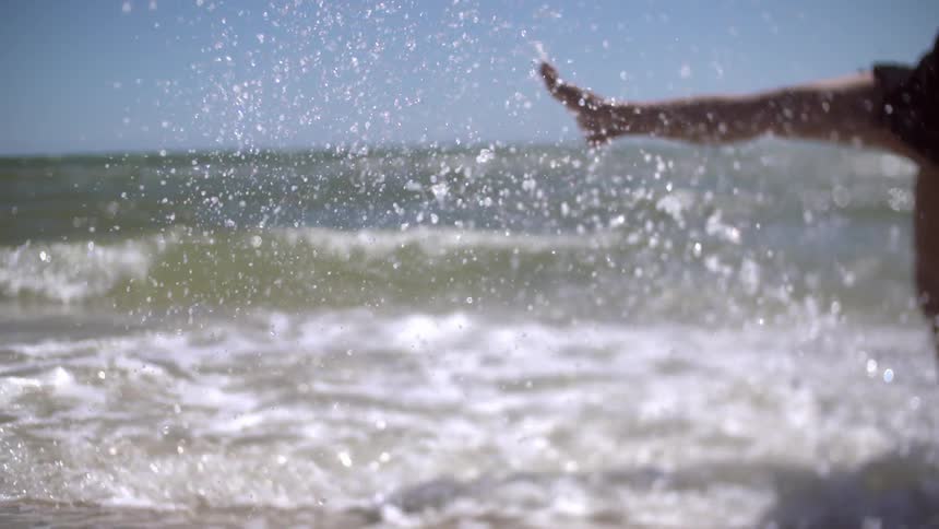 Person splashing in the ocean