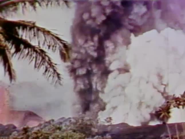 Smoke and steam erupting from a volcano