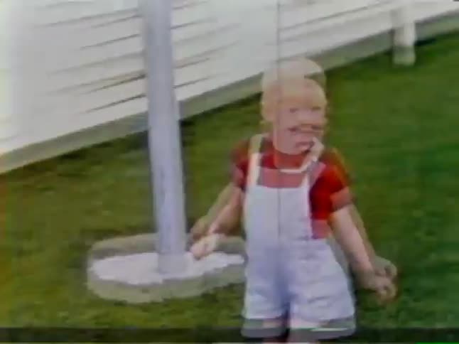A child runs across the lawn