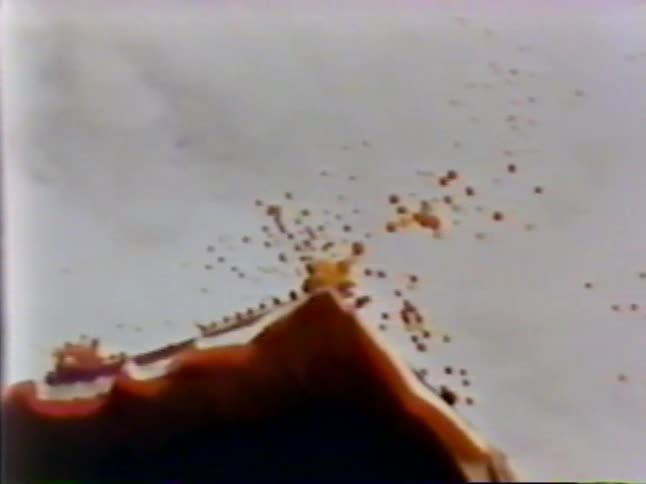 Ash floats off lava into the clouds