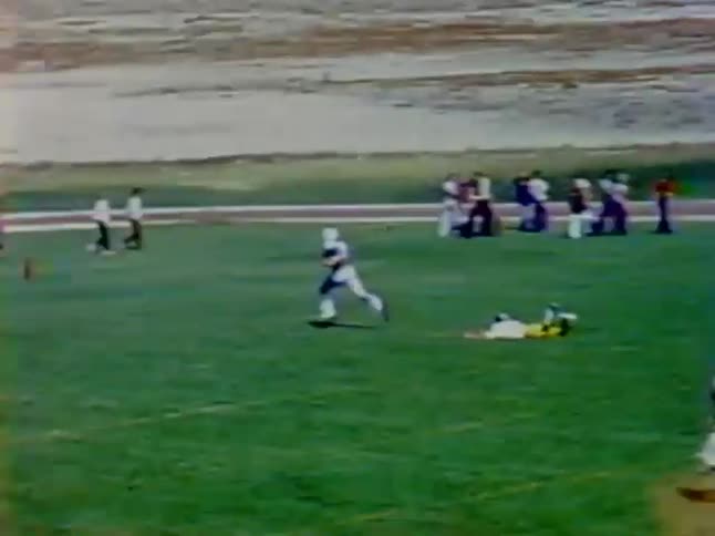 A football player outruns everyone on the field