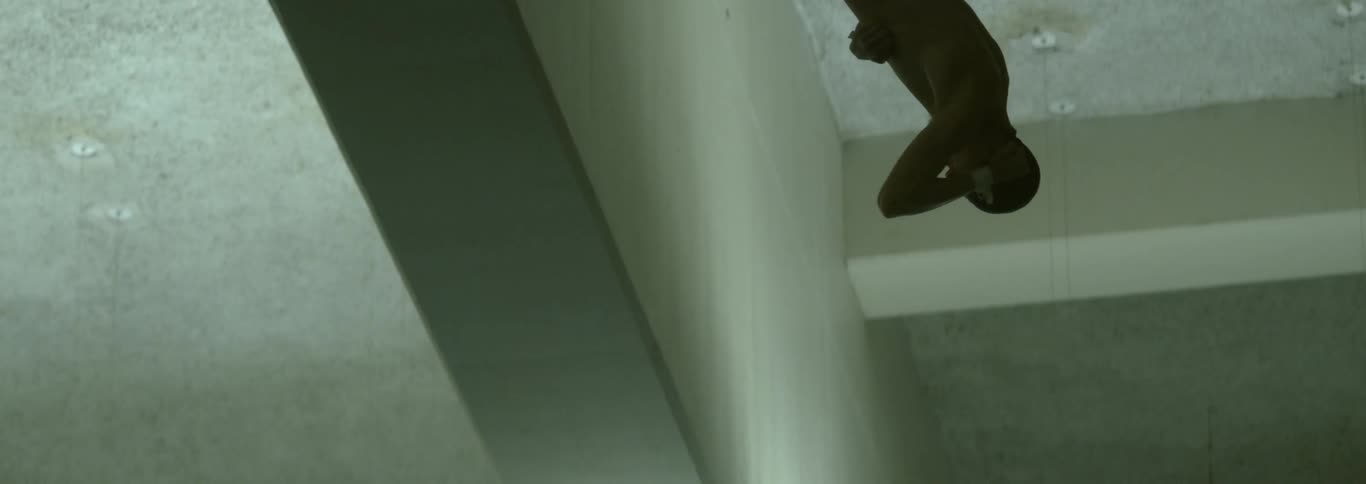 The diver is spinning as he dives down