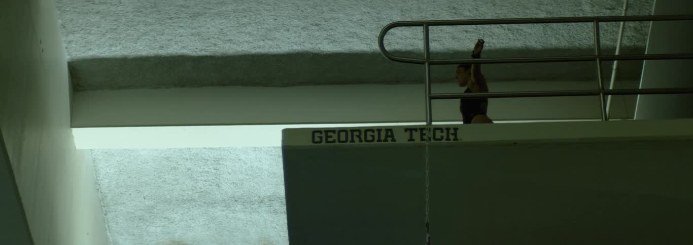 Athlete prepares for a dive from the platform at the georgia tech aquatic center
