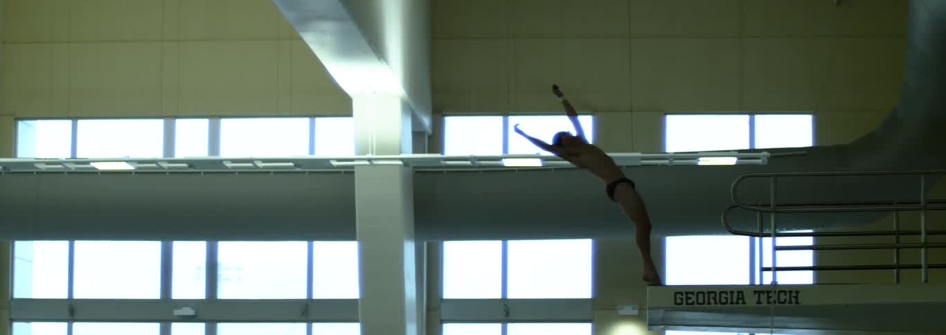 The diver backflips off the platform