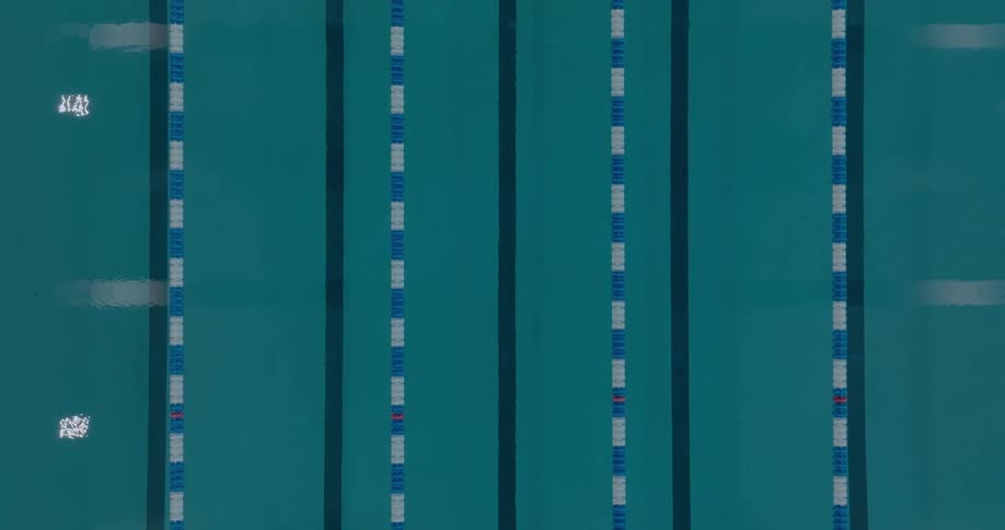 Sports pool viewed from above with lanes divided by buoys