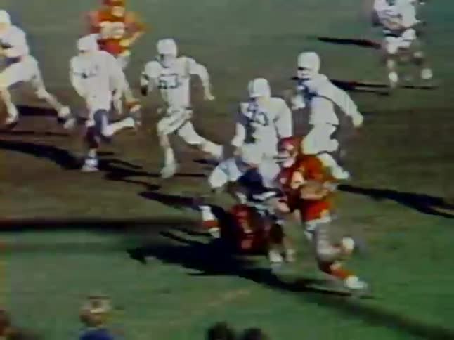 The runner is tackled during a high school football game