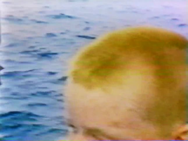 A boy is riding on a boat