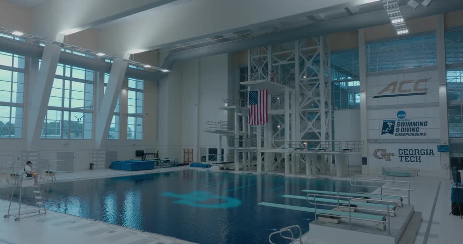 An indoor swimming competition pool area during daytime