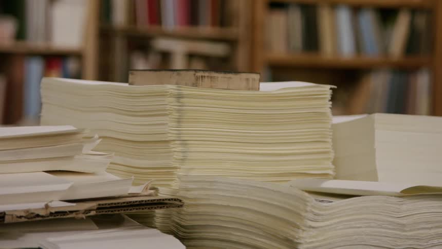 Stacks of papers on a desk