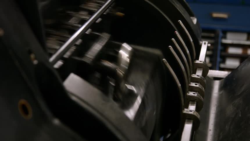 The cylinder is spinning in the printing press