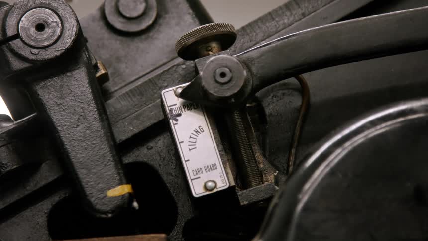 Closeup of an industrial machines adjustment lever and indicator