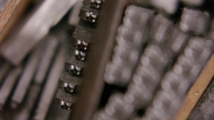Metal pieces of movable type for printing arranged in a case