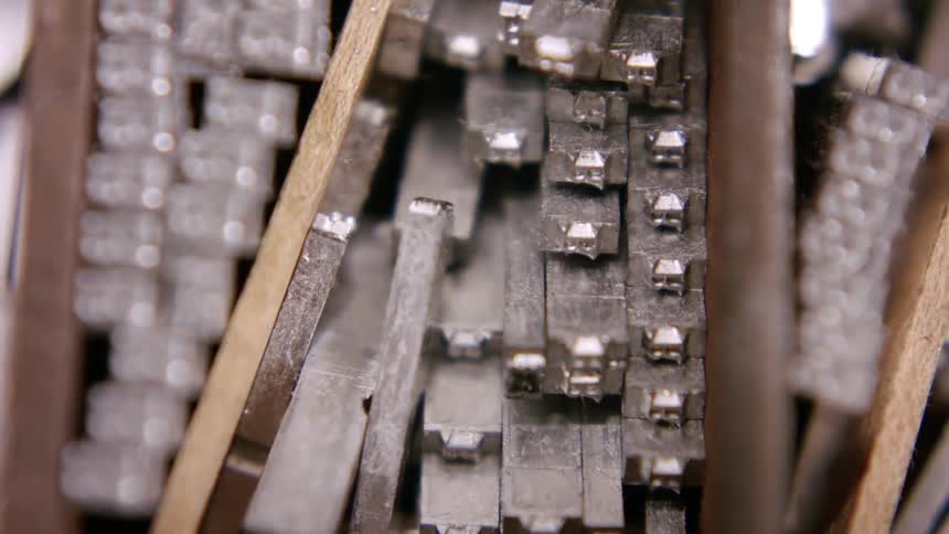 Stacks of metal typesets are stored