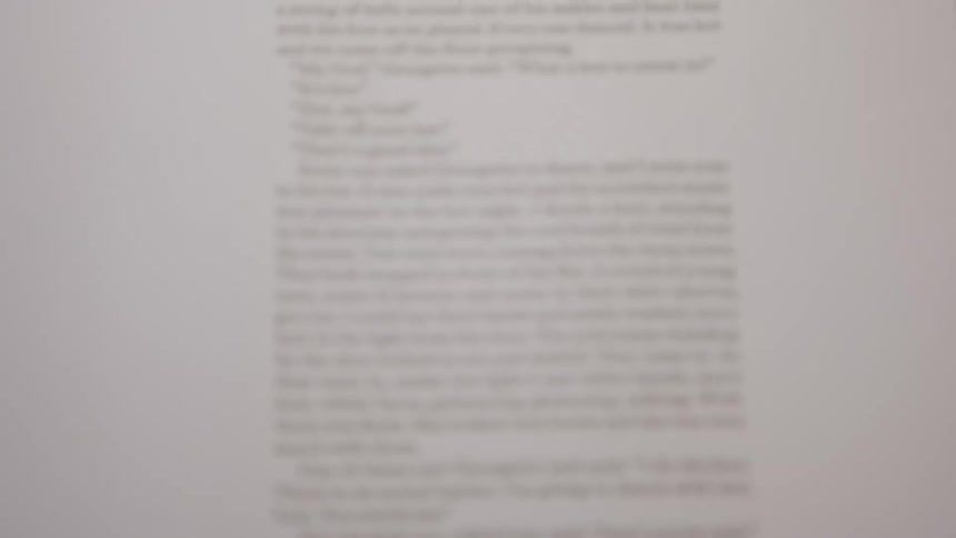 A white page of a book with black text is shown and the pages are turned to reveal a new section with the heading the sun also rises and a passage of readable text below it