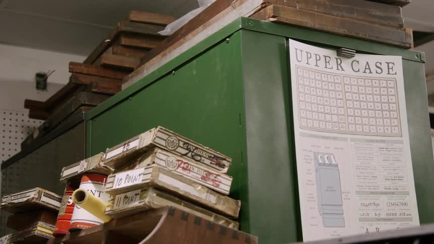 Typesets are stacked by the shelves