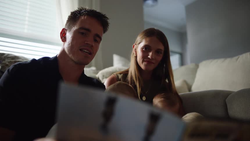 Father reading a story to his family