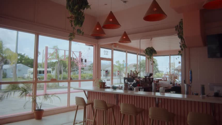 Counter of a modern caf with barstools and hanging lamps