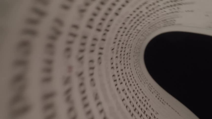 The page full of words is folded over