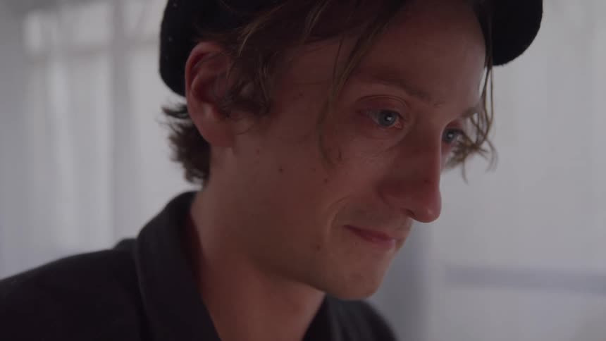 Close up portrait of a young man indoors during daytime