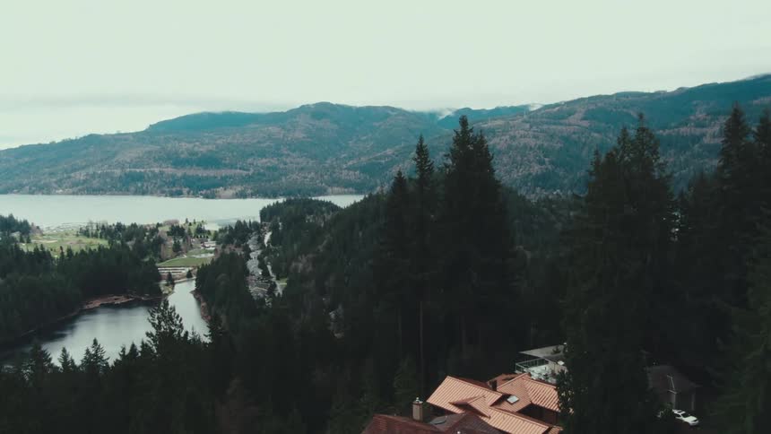 Pinecovered mountains surround lakes with dark and calm waters