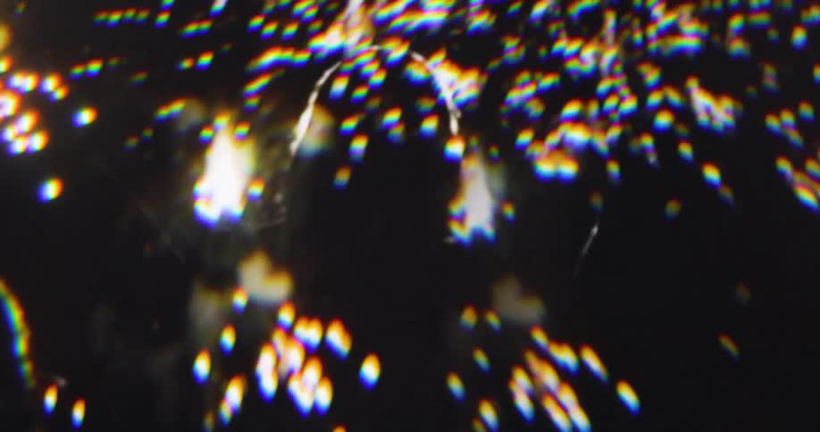 The people are looking up at the sky full of exploding fireworks