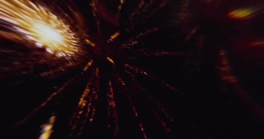 The fireworks shoot up into the sky and explode in all directions