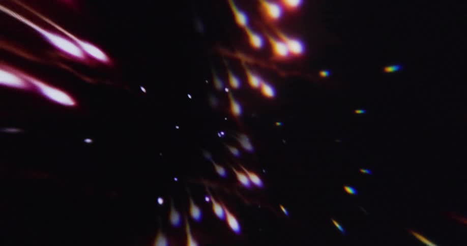 Fireworks bursting against a dark background