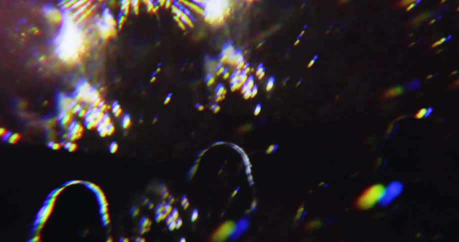 People watch fireworks bursting in the night sky