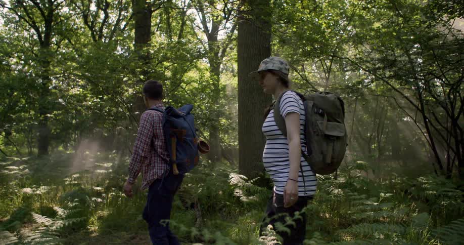 Woman and a man hiking in the forest