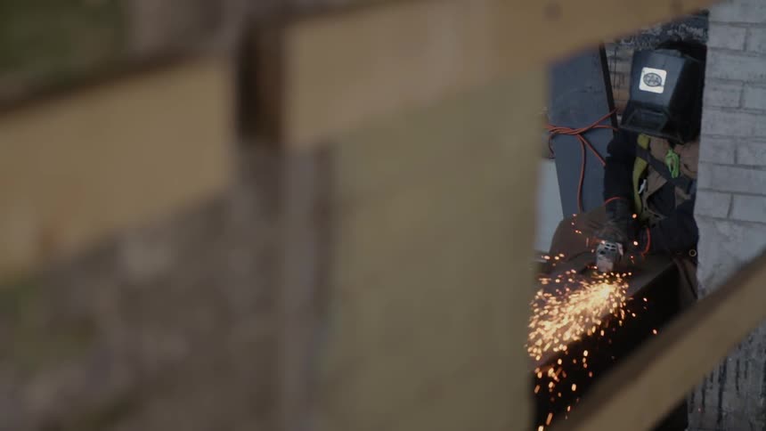 A person is welding in a shop