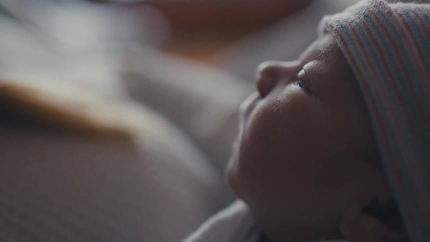 The newborn is sleeping at home