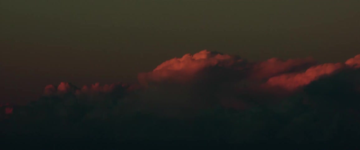 The sun sets on the clouds