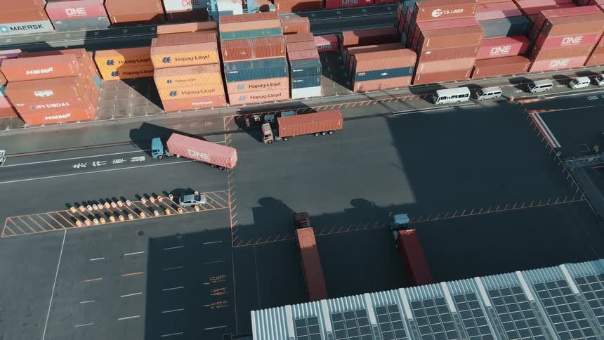 The trucks leave the warehouse on the harbor
