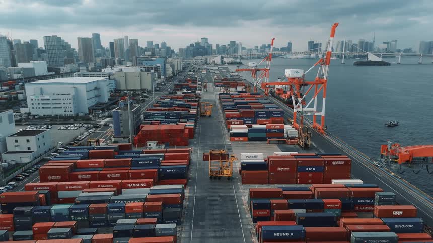 Aerial view of a logistics process with containers on the seafront