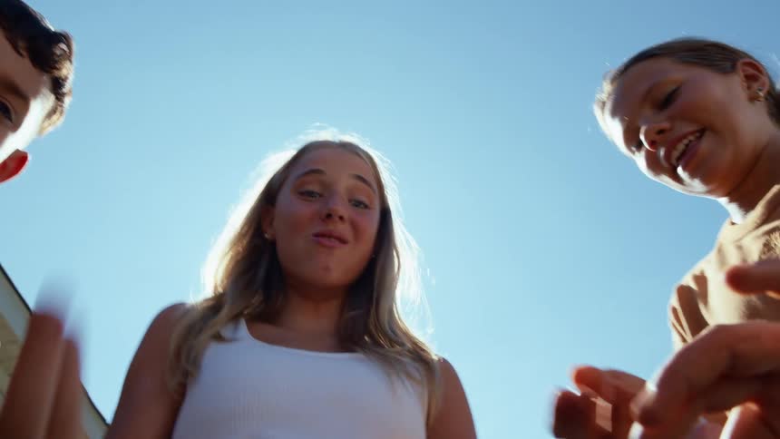 Point of view from a bag of chips as a woman and kids reach into it
