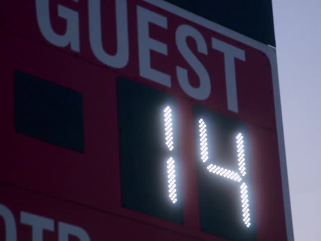 Football scoreboard showing the away team has 14 points