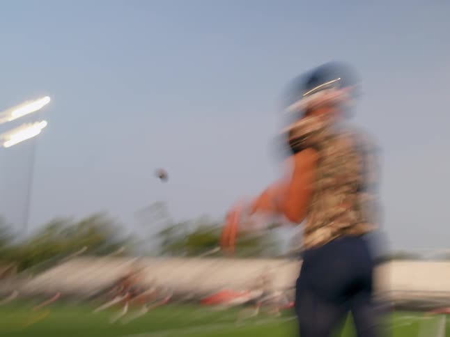 Player throwing an american football