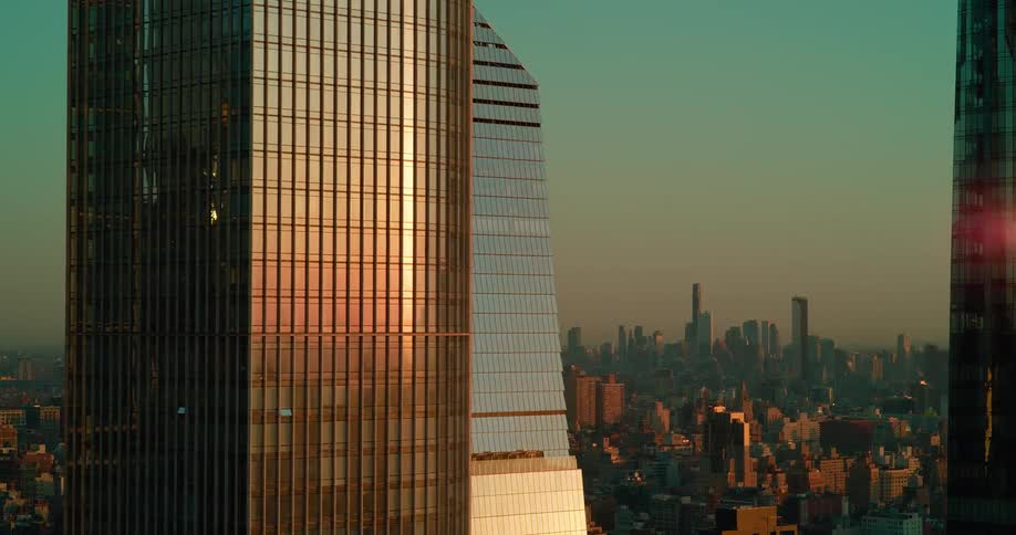Skyscrapers reflect the sunset light over the city