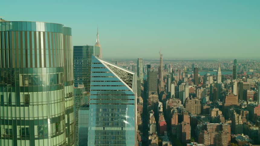 Modern skyscrapers reflect daylight over the urban landscape