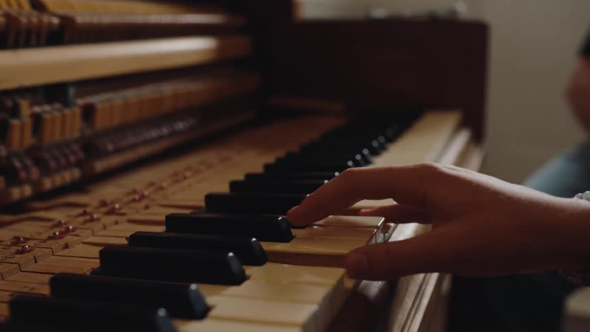 Fingers of a hand playing piano