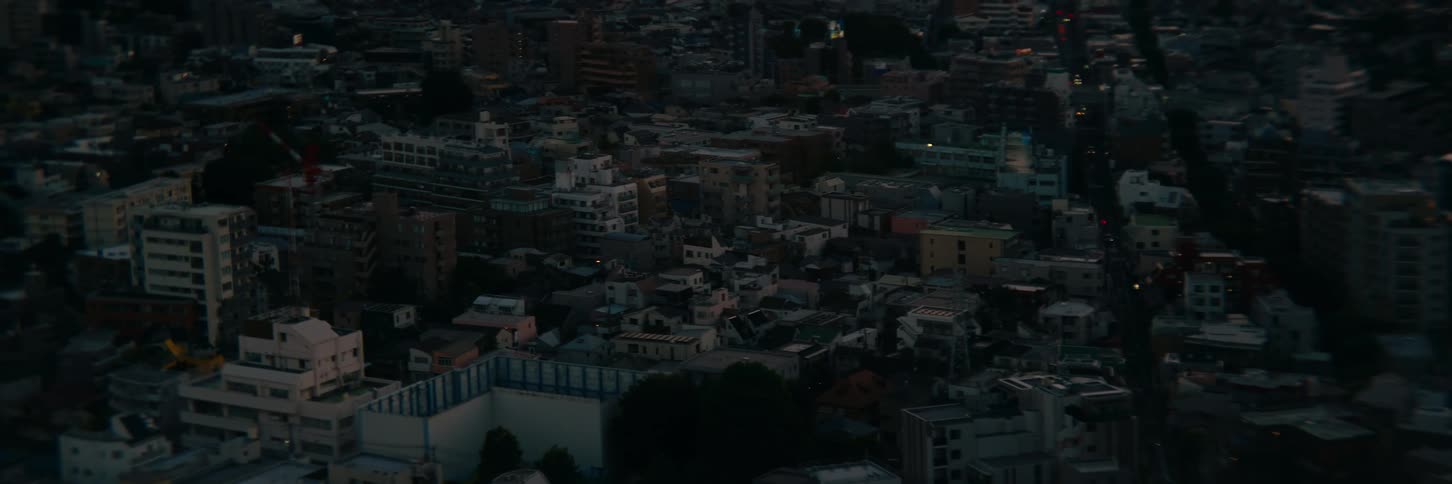 Sunlight falling on urban sprawl as dawn comes