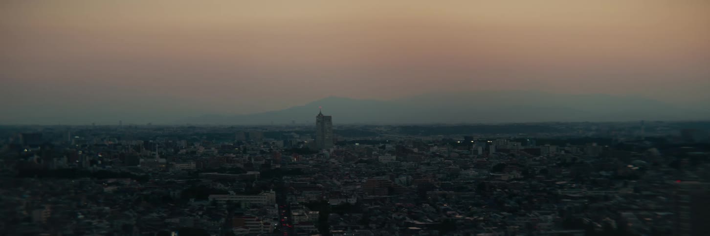 Aerial panorama of a cloudy sunrise in a city
