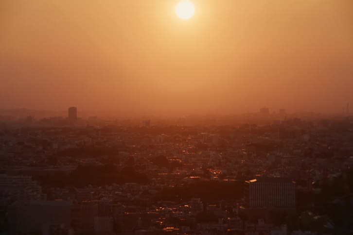 Golden sun over an urban city